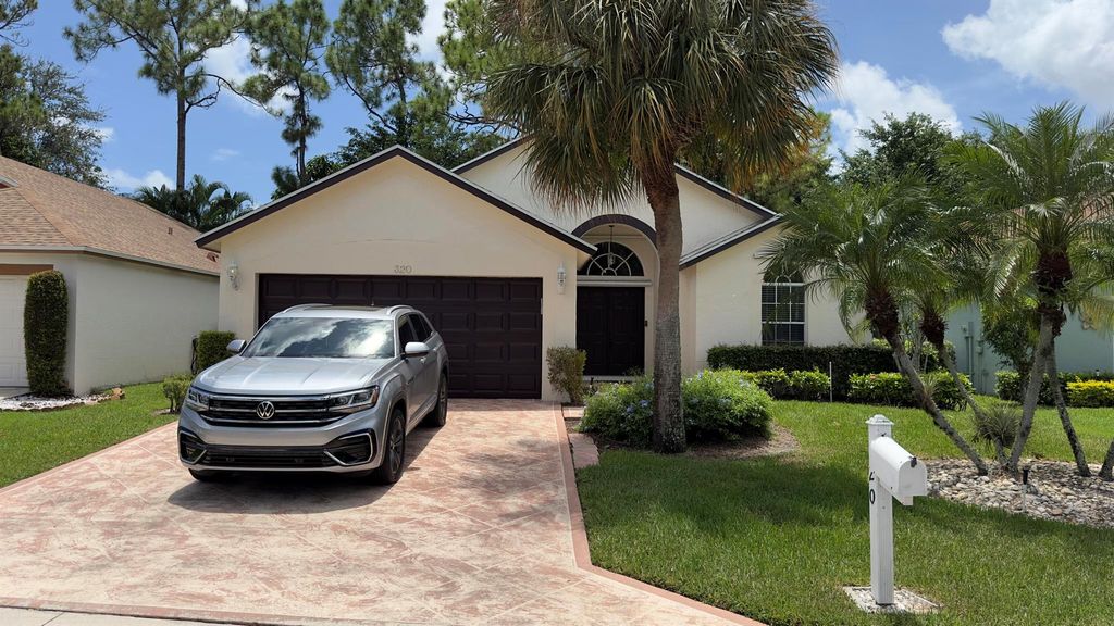 Photo of 320 Hammocks Trail, Greenacres, FL 33413 (MLS # R11118893)