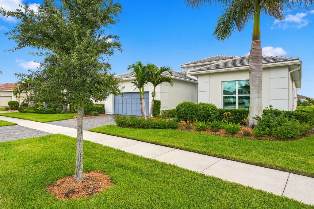 Photo of 8711 SW FLUTTO Way, Port Saint Lucie, FL 34987 (MLS # B26079694)