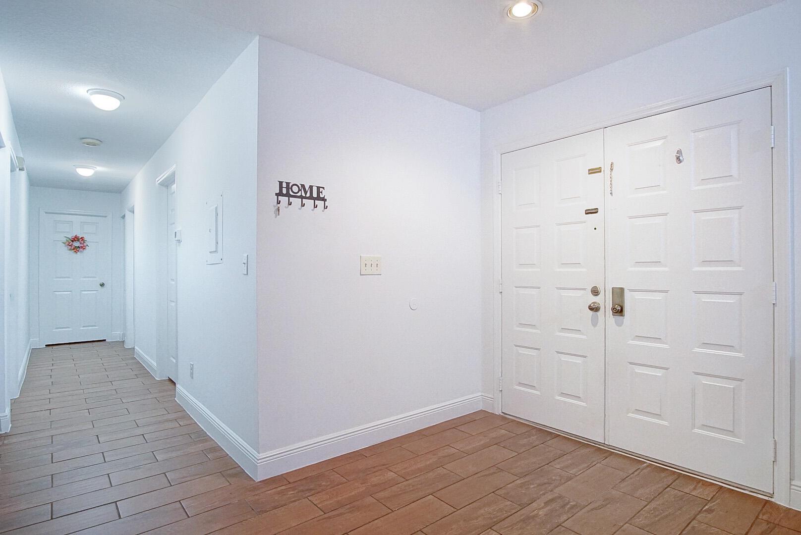 Beautifully Remodeled 3 bedroom 2 bath Villa! This property features an Open kitchen with Upgraded white cabinets, granite counter tops, and stainless steel appliances. Master Bedroom has a walk in closet and private enclosed patio area. The living area has wood look tile throughout and the A/C was recently replaced June 2023. This community has two pools and a walking trail. Close to Beaches, Lawnwood Stadiums, Indian River State College, and Lawnwood Hospital.