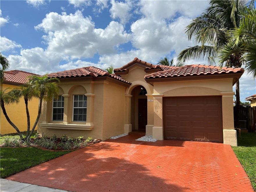 SPACIOUS 3/2 HOME IN MIRAMAR, SOMERSET II COMMUNITY, INTERIOR AND EXTERIOR FRESHLY PAINTED, NEW FLOORING, CROWN MOLDING AND SO MUCH MORE. READY TO GO. CORPORATE OWNED PROPERTY SEE SELLERS ADDENDUM. GATED COMMUNITY.