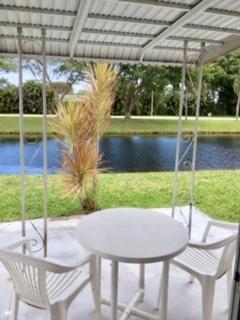 Multiple Offers - Highest and Best due 4/14 @ 4 PM 2/2 CORNER VILLA OVERLOOKING WATER! FRESHLY PAINTED, POPCORN REMOVED! PORCELAIN 12x24 TILE TROUGHOUT THE HOME. UPDATED KITCHEN GENUINE BUTHCER BLOCK AND GLASS PENCIL TILE BACKSPLASH. UPDATED BATHROOMS. NEW CEILING FANS AND LIGHT FIXTURES, FULL SIZE WASHER AND DRYER GREAT 55+ COMMUNITY WITH LOTS OF CLUBS AND ACTIVITIES, ACTIVE CLUBHOSE! WONDERFUL NEIGHBORS!NESTLED IN DELRAY VILLAS THIS 55+ COMMUNITY IS A QUIET AND SAFE NEIGHBORHOOD.SHORT WALK TO POOL. HOA INTERVIEW & APPROVAL REQUIREDDelray Villas plat 1 is a non-gated 55 plus community. There is a heated pool down the block from our villa, as well as a larger heated pool on the lake at our main clubhouse, which is situated between Lake Ida Road and Via Delray, off of El Claire R