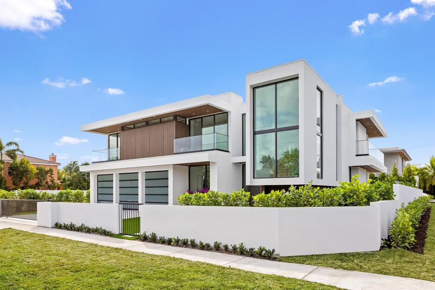 Welcome to 1099 NE 4th Avenue, Boca Raton; a newly completed ultra-luxury estate located in the highly sought-after community of Boca Villas. Encompassing approximately 6,641 total square feet, this exceptional new construction by Empire Development offers six bedrooms, six full bathrooms, and one half-bath, thoughtfully designed for elevated modern living. Set on a prime corner lot in downtown Boca Raton, the residence enjoys a coveted location just moments from Mizner Park, The Boca Raton, and some of South Florida's most celebrated beaches.1099 NE 4th Ave showcases a masterful contemporary aesthetic defined by clean architectural lines, dramatic scale, and meticulous craftsmanship.