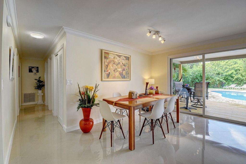 Photo of 1636 NE 3rd Avenue, Delray Beach, FL 33444 (MLS # R10938031)