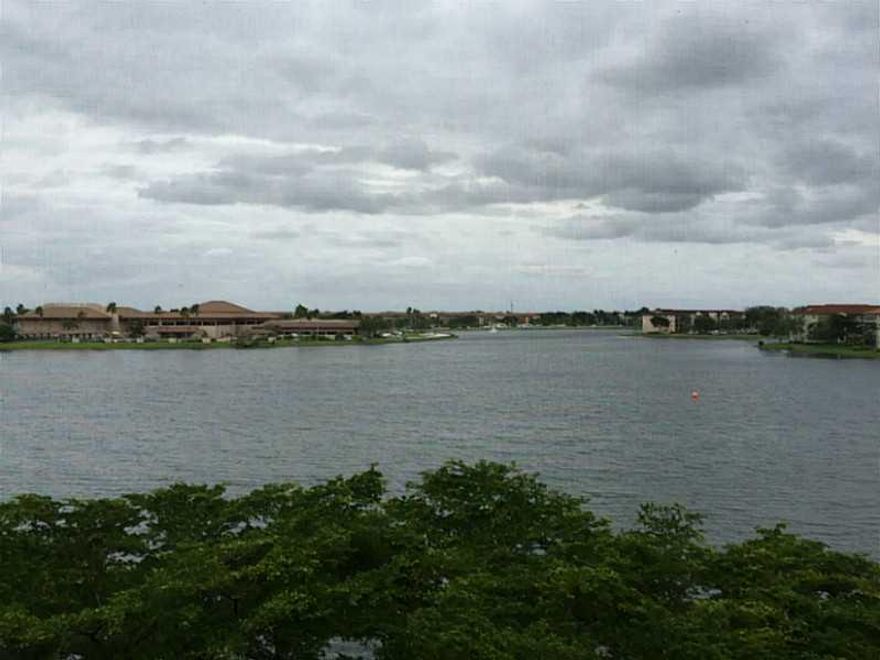 Amazing Lake View Jasmine Model w/ Eat-in Kitchen w/ Pass Through Window. Washer/Dryer located in Condo, Accordion Shutters, Furniture Available. Attic Storage, Washer/Dryer in Your Apartment, HOPA Community w/ Million Dollar Clubhouse, 2 Fitness Centers,  Tennis, Golf, Café, Pharmacy, 24 hr. Security, Free Bus & Much More!