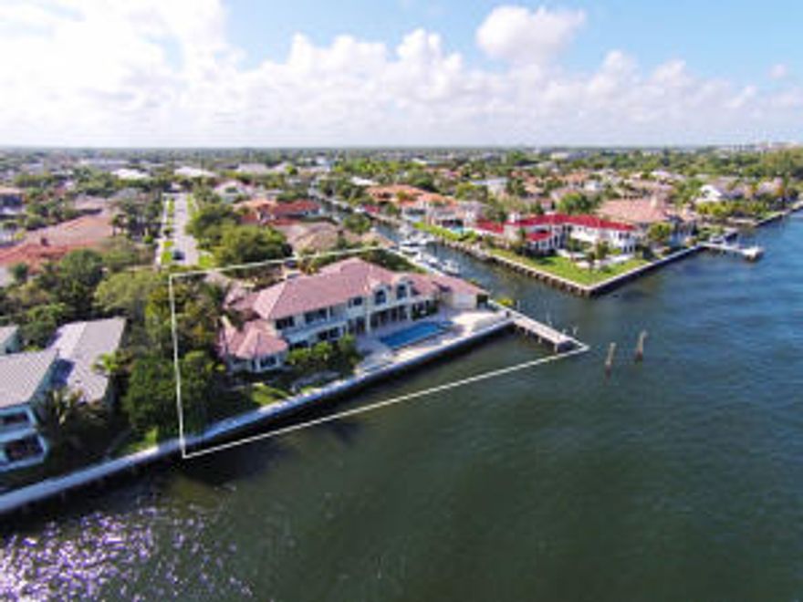 Featuring 213' of water frontage in a point location only minutes to the Palm Beach Inlet, this casually elegant estate has been meticulously designed.  Deep water dockage for a 72' plus yacht and a  captain's storage room make this estate the perfect boater's paradise. Incredible wide water views highlight almost every room in the home.  Designer features include wood flooring, granite counters, expansive kitchen with chef's island, detailed crown moldings, private master suite complete with adjoining sitting room perfect for a nursery or study &  5 spacious guest rooms. The dramatic resort style infinity edge pool with a spa is surrounded by a generous entertainment deck with a separate summer kitchen.  Don't miss this opportunity!