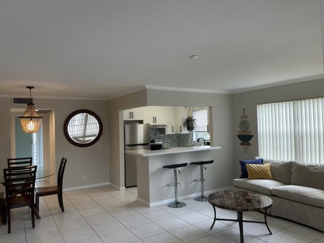 Beautiful, light and bright, corner, 1 bedroom 1 1/2 bathrooms Condo. New AC, Renovated kitchen and bathrooms,tiled throughout. Only some steps to the Pool, laundry on the same floor, great garden view from the living room.Come and enjoy resort style living right here in Century Village, West Palm Beach housing for 55+.