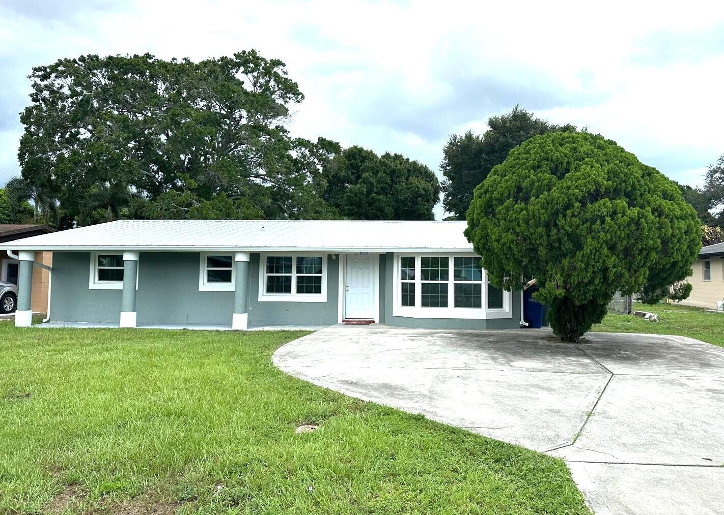 It's All About Location!!! Quaint & Tranquil 3 BR 2 Bath House with Metal Roof, Storm Windows, Great Interior Layout, New Kitchen, New Bathrooms, Lots of Storage, Long Front Porch and Serene Backyard, Close to Downtown Fort Pierce, Beaches, Shoppes, Hospital, and More!