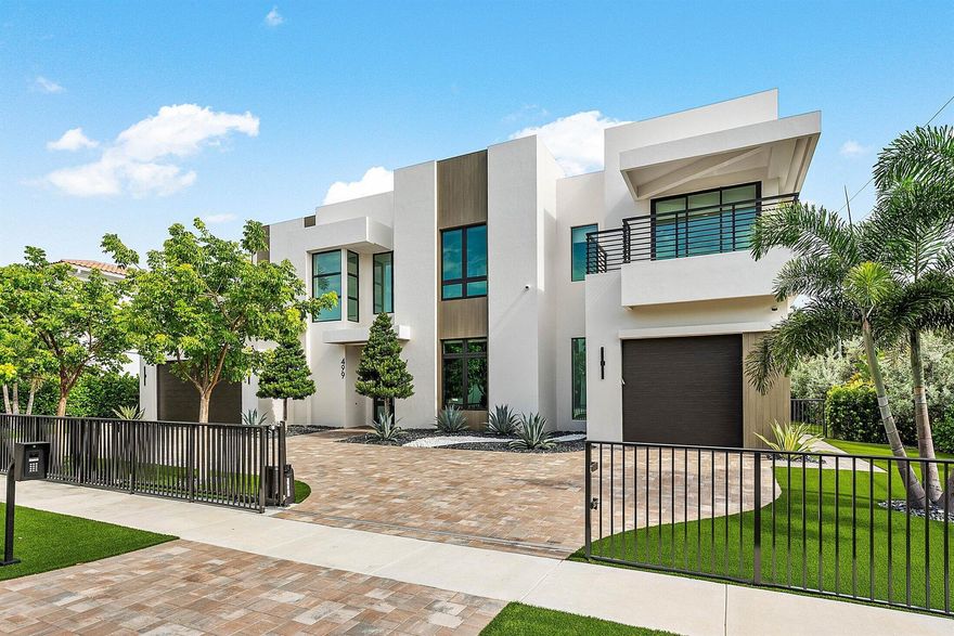 Prestigious Boca Villas. Built to perfection by Primo Construction, this extraordinary estate in the heart of Boca Villas redefines luxury coastal living. Ideally located just steps from the beach and within walking distance to Mizner Park, Royal Palm Plaza, celebrated restaurants, boutique shopping, and the world-renowned The Boca Raton Resort and Premier Club, it offers the ultimate in both lifestyle and location. Spanning 5,176 square feet with 5 bedrooms and 4.1 baths, this residence is a masterpiece of craftsmanship and design. The spectacular gourmet kitchen features Miele appliances, a custom refrigerated wine unit, and a hidden walk-in butler's pantry—perfectly blending functionality with elegance. A whole-house triple water filtration and purification system & full home generator water system, and full house generator ensure convenience, comfort, and peace of mind in every season. Sophisticated living spaces are enhanced by a decorative fireplace, custom lit built-ins, designer lighting and wallpaper accents, hard-wired blinds, and custom window frosting throughout. The home also features a beautifully appointed office and an elegant clubroom that can easily be converted into the fifth bedroom to suit changing needs. 
Technology and security are seamlessly integrated with a whole-house multi-zone music system, 360° camera security, alarm system, and WiFi/service extenders indoors and out, plus a smart garage and gate system for effortless living. Wellness and leisure abound with a commercial-grade built-in steam room, outdoor infrared sauna, and a saltwater pool and spa set amid designer landscaping, luxury turf, and captivating outdoor lighting. Additional highlights include a Split-system AC in the double garage, Electric vehicle hook-up, large storage closet in the garage and Stunning custom designer furnishings included. From its Primo Construction pedigree to its fusion of high design, flexible living spaces, cutting-edge technology, and resort-style amenities, 499 NE 4th Street stands as one of Boca Raton's most remarkable offerings in a premier walkable location.