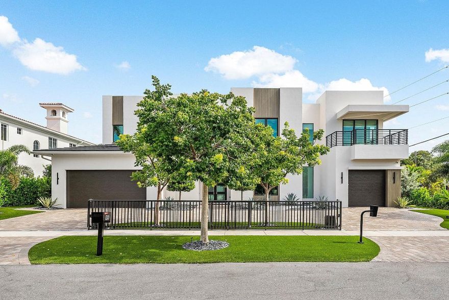 Prestigious Boca Villas. Built to perfection by Primo Construction, this extraordinary estate in the heart of Boca Villas redefines luxury coastal living. Ideally located just steps from the beach and within walking distance to Mizner Park, Royal Palm Plaza, celebrated restaurants, boutique shopping, and the world-renowned The Boca Raton Resort and Premier Club, it offers the ultimate in both lifestyle and location. Spanning 5,176 square feet with 5 bedrooms and 4.1 baths, this residence is a masterpiece of craftsmanship and design. The spectacular gourmet kitchen features Miele appliances, a custom refrigerated wine unit, and a hidden walk-in butler's pantry—perfectly blending functionality with elegance. A whole-house triple water filtration and purification system & full home generator water system, and full house generator ensure convenience, comfort, and peace of mind in every season. Sophisticated living spaces are enhanced by a decorative fireplace, custom lit built-ins, designer lighting and wallpaper accents, hard-wired blinds, and custom window frosting throughout. The home also features a beautifully appointed office and an elegant clubroom that can easily be converted into the fifth bedroom to suit changing needs. 
Technology and security are seamlessly integrated with a whole-house multi-zone music system, 360° camera security, alarm system, and WiFi/service extenders indoors and out, plus a smart garage and gate system for effortless living. Wellness and leisure abound with a commercial-grade built-in steam room, outdoor infrared sauna, and a saltwater pool and spa set amid designer landscaping, luxury turf, and captivating outdoor lighting. Additional highlights include a Split-system AC in the double garage, Electric vehicle hook-up, large storage closet in the garage and Stunning custom designer furnishings included. From its Primo Construction pedigree to its fusion of high design, flexible living spaces, cutting-edge technology, and resort-style amenities, 499 NE 4th Street stands as one of Boca Raton's most remarkable offerings in a premier walkable location.