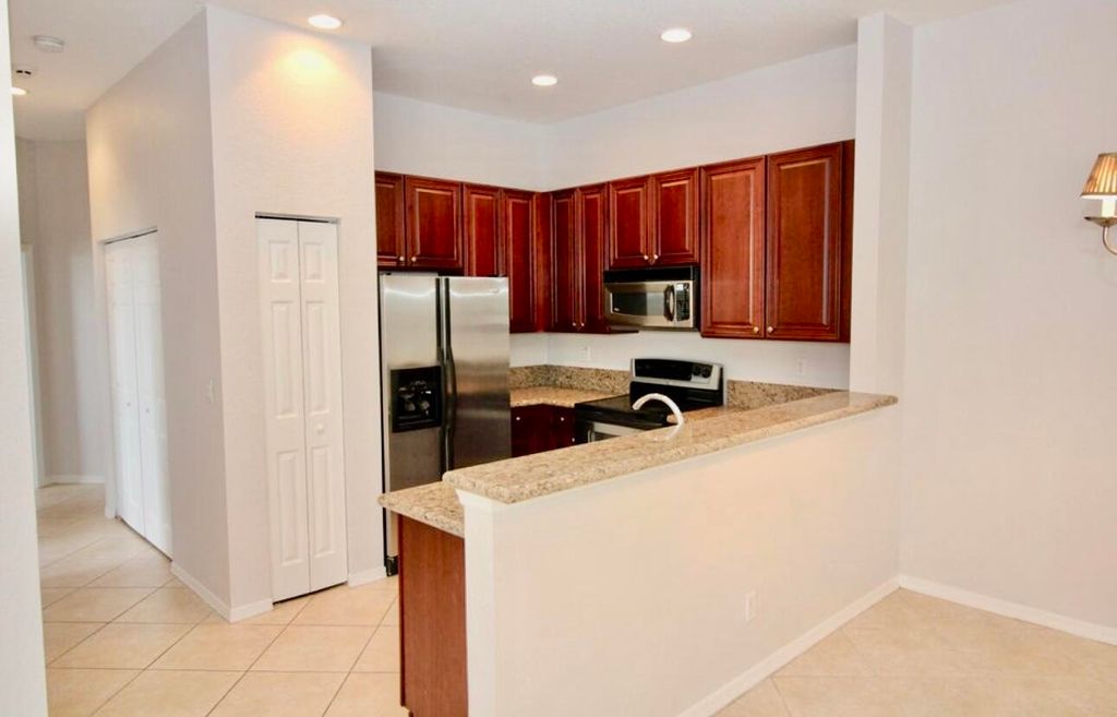Photo of 4930 Bonsai Circle #208, Palm Beach Gardens, FL 33418 (MLS # R11007339)