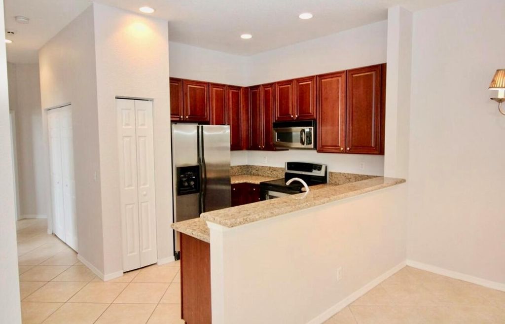 Photo of 4930 Bonsai Circle #208, Palm Beach Gardens, FL 33418 (MLS # R11007339)