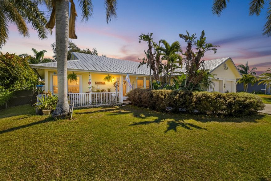 Charming and beautifully maintained Key West-style tropical home offering 3 bedrooms, 2 bathrooms, and an oversized 2-car garage. With 1,655 sq. ft. of living space and 2,568 total square feet, this home features an open, inviting layout designed for comfortable everyday living. Vaulted ceilings, crown molding, chair rails, and tile flooring throughout create a bright, cohesive space that's both stylish and easy to maintain.
The spacious master bathroom has dual sinks, a separate shower, and a relaxing spa tub. Enjoy Florida's indoor-outdoor lifestyle on the tiled, screened-in back porch, or unwind on the covered front porch swing accented by a charming white fence railing that enhances the home's curb appeal. The fully fenced backyard, lined with lush clusia plants, offers exceptional privacy and includes a storage shed for added convenience. Recent upgrades provide peace of mind, including a brand-new roof (2024), A/C replacement (2022), newer appliances, fresh interior paint, and a new side entry door. Ideally located near I-95 and the Florida Turnpike for easy commuting, and just a few blocks from Peacock Park, soon to feature a new playground and walking trails opening this summer! Seller offering a $2,000 closing credit to Buyer to be applied toward backyard landscaping, allowing the new owner to customize the outdoor space.