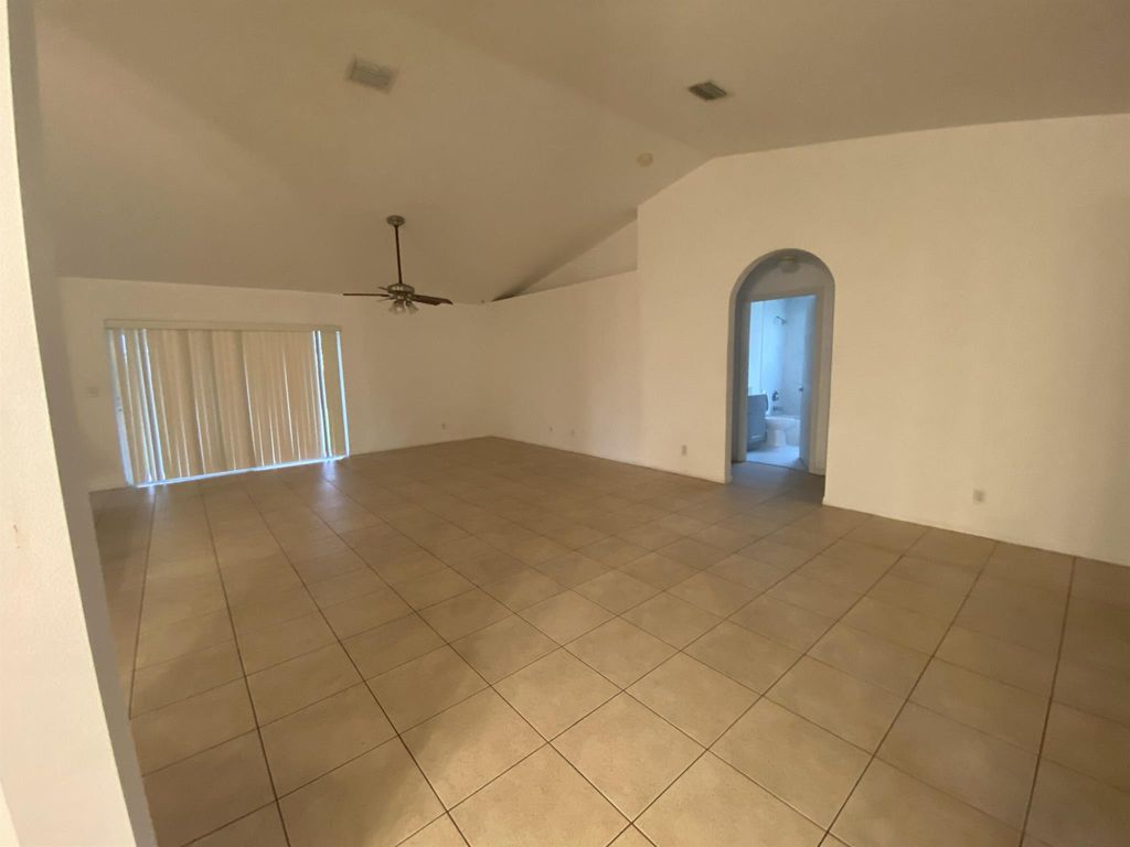 Photo of 1449 SW Jacksonville Avenue, Port Saint Lucie, FL 34953 (MLS # R10996909)