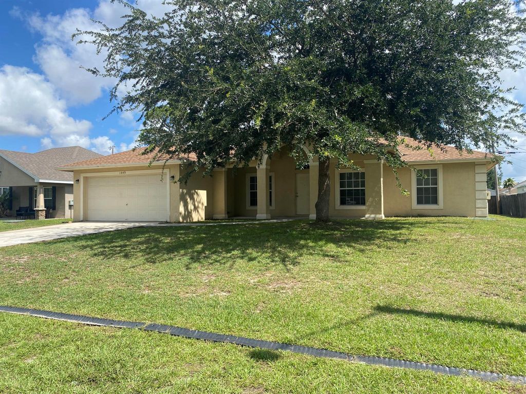 Photo of 1449 SW Jacksonville Avenue, Port Saint Lucie, FL 34953 (MLS # R10996909)