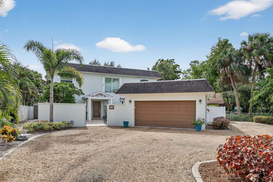 Prime location and a beautiful remodel makes this home the one you've been looking for! This gorgeous 3/2.5 plus office is concrete block with impact windows. It's been beautifully remodeled by the current owners and is move-in ready! The large kitchen is a dream for preparing meals for your family or entertaining. Multiple living areas give everyone space to relax. There is a private screened balcony off the master bedroom to enjoy quiet mornings or cool evenings. The location is unbeatable - imagine riding your bike to downtown Stuart and enjoying a morning coffee or brunch before heading to the beach for the afternoon! It includes a two car garage with a circular driveway which allows for ample parking. No HOA and there's room to store a boat or small RV.