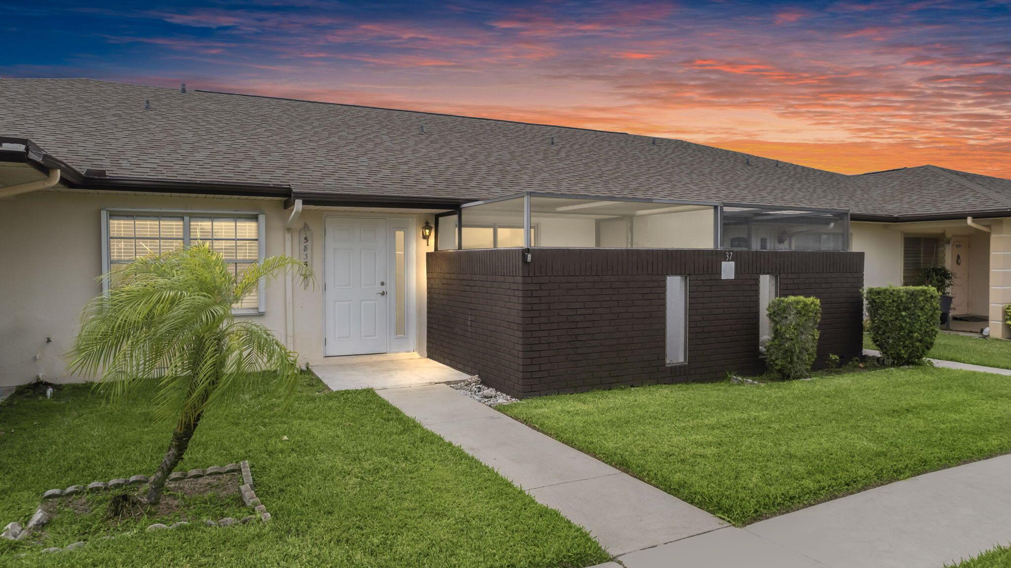 55+ community - Freshly painted. Light & bright, this unit has updated tile placed on the diagonal & crown molding throughout. The kitchen features updated stainless steel appliances. The laundry room comes equipped with a full size washer/dryer with pull down attic access for additional storage. The AC is only 1 year old, HWH 4 years old. With poured concrete block construction, accordian hurricane shutters & impact glass sliding glass door, you are well equipped to ride out any storm in style! The Grove features a heated pool year round, clubs, shuffleboard, tennis, bocce, corn-hole tournaments, holiday parties & so much more. Located in the middle of Ft Pierce & Port St Lucie city limits, you are only minutes from both cities shopping, dining, theater, & pristine beaches.