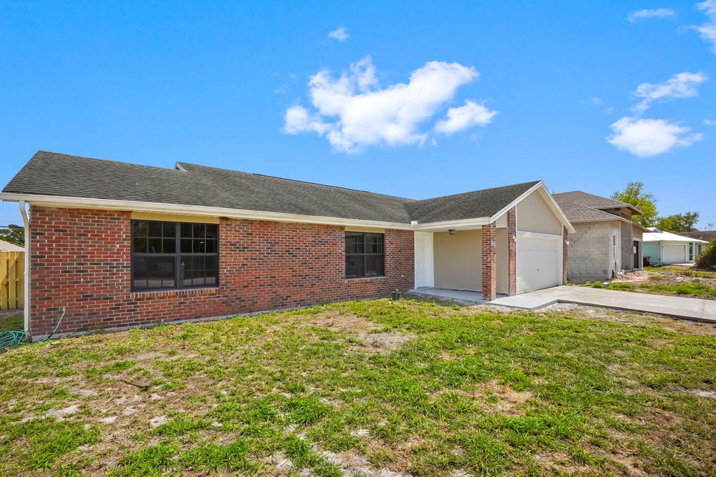 Photo of 4209 SW Tuscol Street, Port Saint Lucie, FL 34953 (MLS # B26007498)