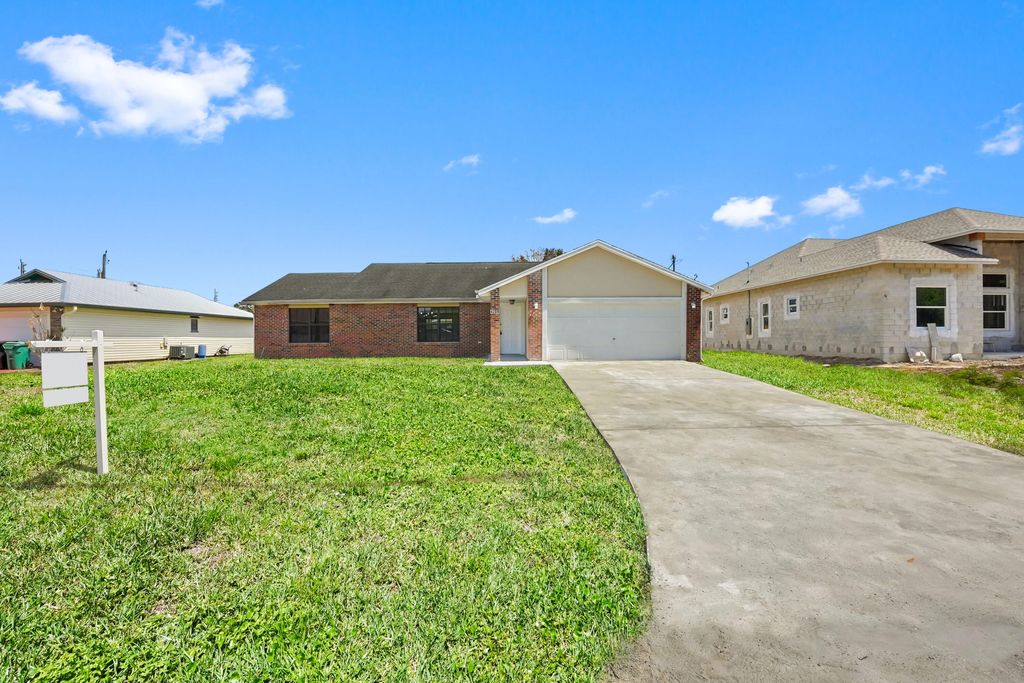 Photo of 4209 SW Tuscol Street, Port Saint Lucie, FL 34953 (MLS # B26007498)