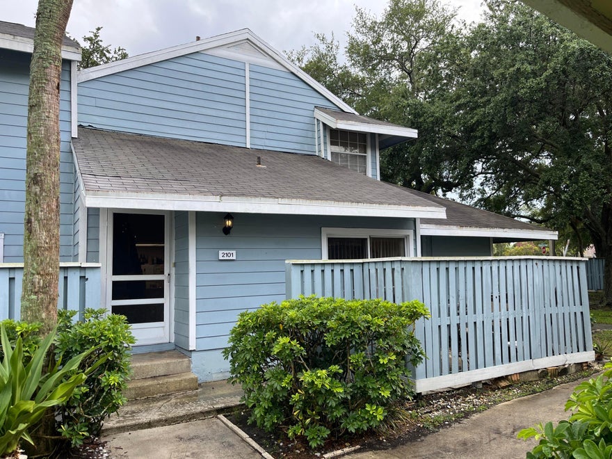 This two-bedroom, two-bath corner townhouse located in Players Place offers a great opportunity for the right buyer. It has great potential to be updated and customized to suit your needs. Functional layout includes one bedroom and one full bath on the first floor, with a large primary bedroom and full bath upstairs. Features include a washer/dryer closet, tile floors in living areas, separate living and dining spaces, high ceilings, a fenced patio, and assigned parking. Players Place offers a tennis court, community pool and is conveniently located close to the turnpike, shopping and restaurants. Maintenance fees include common areas, trash and roof repairs.