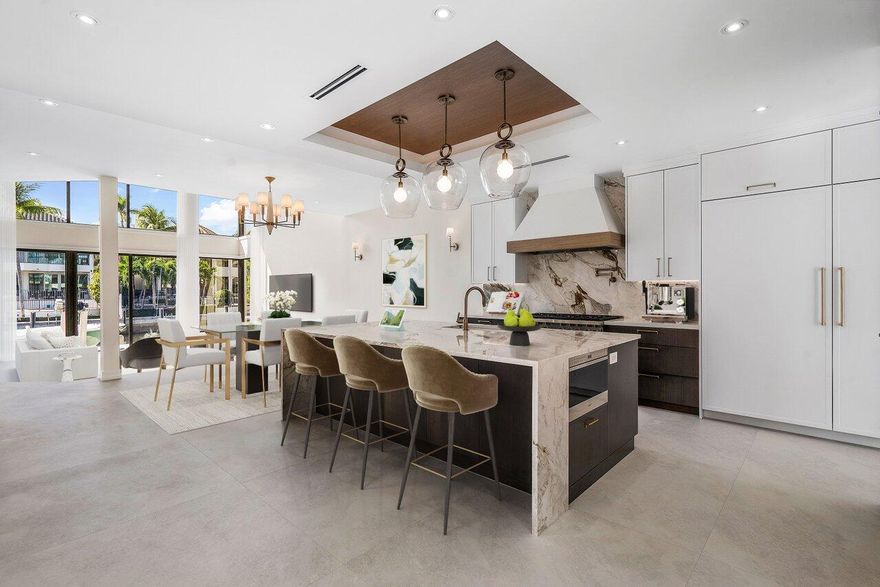 FLORIDA LIVING AT ITS FINEST!

WELCOME TO THIS NEWLY RENOVATED FIVE BEDROOM KEY WEST STYLED WATERFRONT HOME. THIS TOTAL RENOVATION WAS JUST COMPLETED!

LOCATED IN THE DESIRABLE  BOATING COMMUNITY OF BOCA MARINA, ONE OF JUST TWO GATED WATERFRONT COMMUNITIES IN ALL OF BOCA!

 UPON ENTERING, A PRIVATE GATED COURTYARD  GREETS YOU, COMPLEMENTED WITH  AUTHENTIC  CORAL ADORNMENTS . A SPECIAL AND SEPARATE GUEST HOUSE FEATURES A FULL BATH AND MINI FRIDGE.

A HEATED SALTWATER POOL OFFERS A SEPARATE SPA . A SUMMER KITCHEN FEATURES A GAS GRILL AND A BEVERAGE REFRIGERATOR.

UPON ENTERING INTO TH E MAIN HOUSE, OUTSTANDING WATERWAY VIEWS GREET YOU.

THE LIVING ROOM OFFERS SOARING CEILINGS, AND AN ENTERTAINMENT BAR IS COMPLETE WITH ICE MAKER, AND WINE COOLER. A TRUE CHEF'S KITCHEN FEATURES SUB ZERO AND WOLF APPLIANCES, GORGEOUS QUARTZ COUNTERTOPS, AND A MICROWAVE DRAWER. A SPACIOUS AND SUNNY BREAKFAST ROOM AFFORDS COURTYARD VIEWS. ADDITIONALLY, THERE IS A LARGE GUESTE SUITE ON THE FIRST FLOOR.

UPSTAIRS, THE ULTRA LUXURIOUS PRIMARY SUITE OFFERS A WALK OUT BALCONY OVERLOOKING THE WATERWAY AND THE TERRACE BELOW.
THE SUMPTUOUS PRIMARY BATH FEATURES AN OVERSIZED WALK IN SHOWER, SOAKING TUB,TWO SINKS, A MAKEUP VANITY, AND TWO LARGE FULLY OUTFITTED CLOSETS.

TWO ADDITIONAL BEDROOMS UPSTAIRS ARE ALL EN SUITE, AND OFFER THEIR OWN PRIVATE TERRACE. A LARGE ENTERTAINMENT LOFT IS PERFECT FOR FAMILY GATHERINGS.


OUTDOORS, THERE IS 50 FT OF DEEPWATER DOCKAGE AND A 14,000 LB. BOAT LIFT. THE INTRACOASTAL WATERWAY AND THE BLUE ATLANTIC OCEAN IS JUST A SHORT BOAT RIDE AWAY. 

ADDITIONAL SPECIAL FEATURES INCLUDE:

NEW METAL ROOF
ALL IMPACT WINDOWS AND DOORS 
LUTRON LIGHTING SYSTEM
DESIGNER LIGHT FIXTURES AND
CUSTOM CABINETRY THROUGHOUT 
FULL HOUSE GENERATOR
TWO, FIVE TON HVAC'S
CENTRAL VAC SYSTEM

BOCA MARINA YACHT CLUB IS A GATED COMMUNITY OF APPROX. 88 HOMES.
THE TOTAL QUARTERLY HOA FEE IS $4292.
RENTALS ARE PERMITTED ONE TIME A YEAR FOR A MINIMUM OF SIX MONTHS. DOGS ALLOWED, NO AGGRESSIVE BREEDS.


BUYER TO PAY 2 QUARTERS (HOA DUES) CAPITAL CONTRIBUTION AT CLOSING,  TO BOCA MARINA HOA.
 

DISCLAIMER: Information published or otherwise provided by the listing company and its representatives including but not limited to prices, measurements, square footages, lot sizes, calculations, statistics, and videos are deemed reliable but are not guaranteed and are subject to errors, omissions or changes without notice. All such information should be independently verified by any prospective purchaser or seller. Parties should perform their own due diligence to verify such information prior to a sale or listing. Listing company expressly disclaims any warranty or representation regarding such information. Prices published are either list price, sold price, and/or last asking price. The listing company participates in the Multiple Listing Service and IDX.DISCLAIMER: Information published or otherwise provided by the listing company and its representatives including but not limited to prices, measurements, square footages, lot sizes, calculations, statistics, and videos are deemed reliable but are not guaranteed and are subject to errors, omissions or changes without notice. All such information should be independently verified by any prospective purchaser or seller. Parties should perform their own due diligence to verify such information prior to a sale or listing. Listing company expressly disclaims any warranty or representation regarding such information. Prices published are either list price, sold price, and/or last asking price. The listing company participates in the Multiple Listing Service and IDX. No commissions are paid to any cooperating broker until title passes.