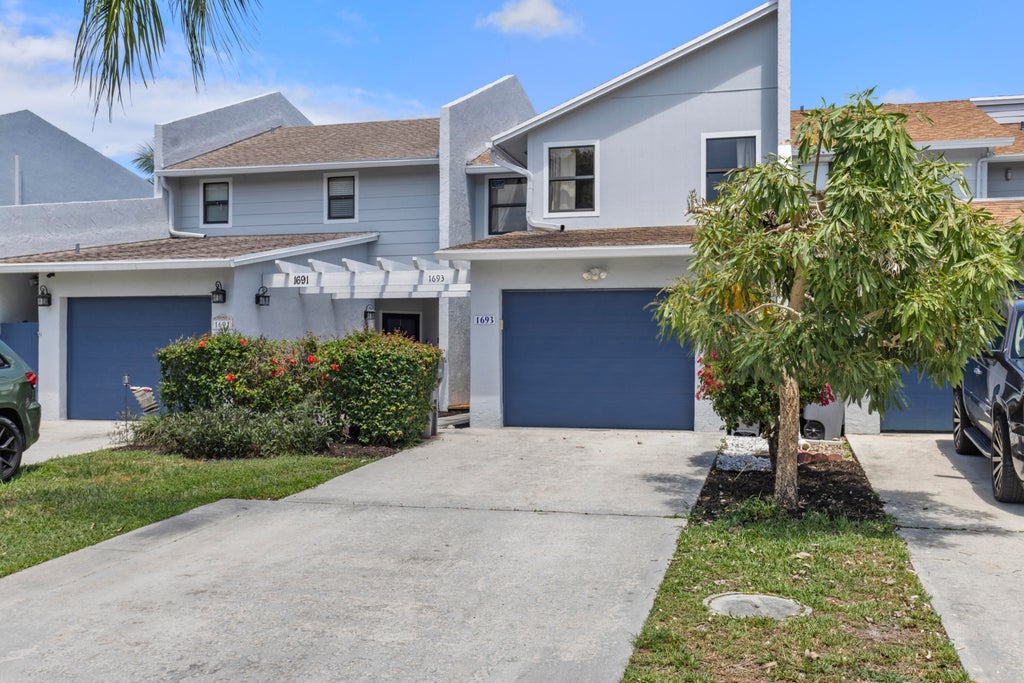 Photo of 1693 Woodbridge Lakes Circle, West Palm Beach, FL 33406 (MLS # R11086078)