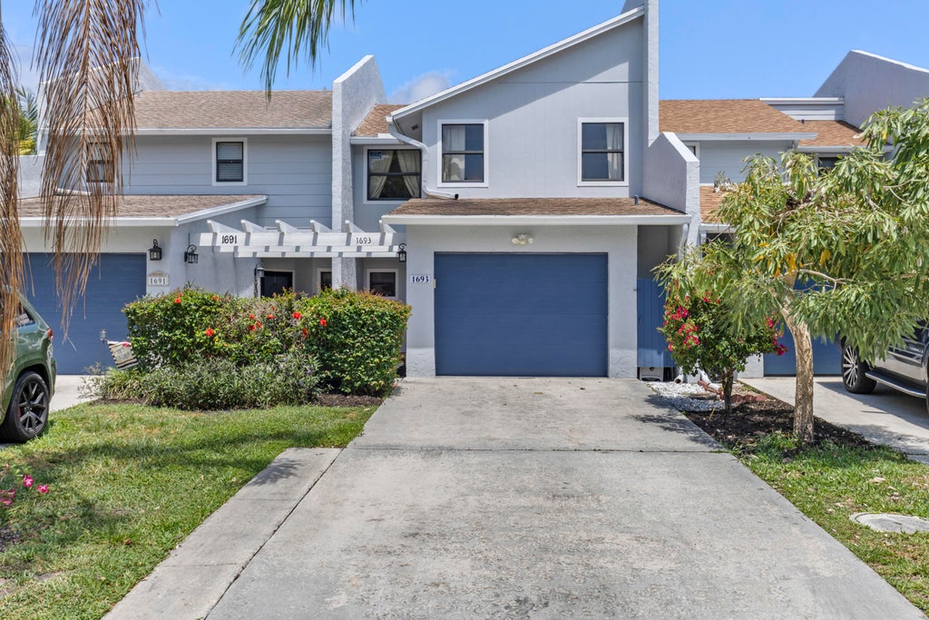 Photo of 1693 Woodbridge Lakes Circle, West Palm Beach, FL 33406 (MLS # R11086078)
