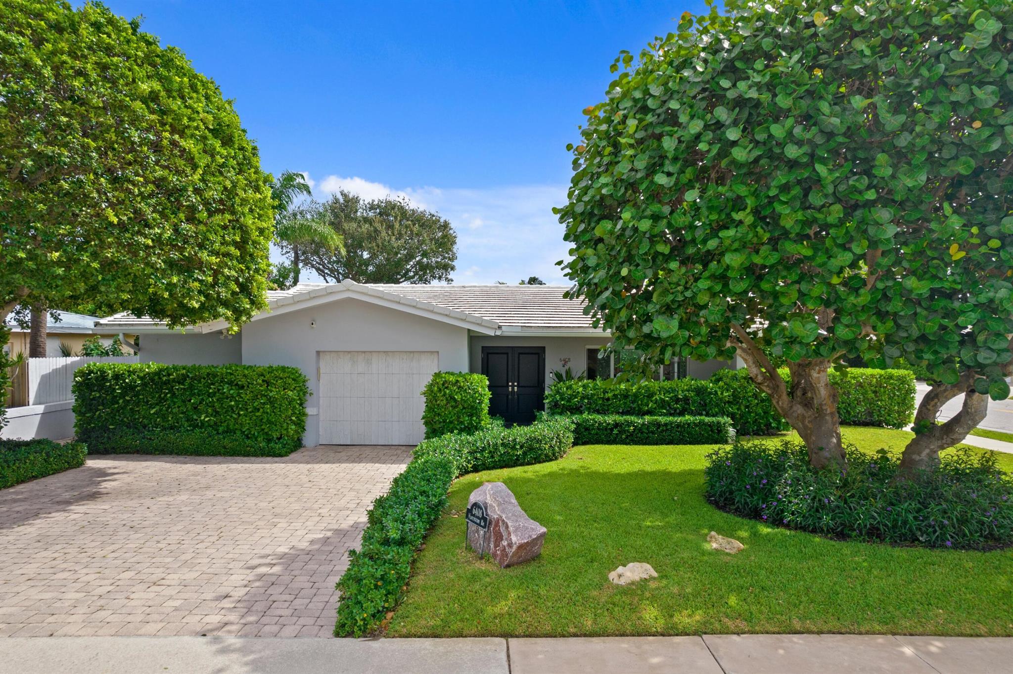 Very charming rental opportunity in the desirable South-of-Southern (SoSo) neighborhood. Move-in ready 3 Bed / 3 Bath home totally updated in 2016, including hardwood floors, all new impact glass as well as a new cement tile roof. One of the home's highlights is the renovated kitchen / family room - perfect for everything from intimate dining to larger scale entertaining. Private fenced in and Calusia-hedged backyard with two inviting terraces framed by bougainvillea overlooking the large lawn area. Just one short block off the Flagler Drive walking path along the intracoastal - perfect for enjoying the South Florida weather and expansive water views. Under a 15-minute drive with easy access to Worth Avenue and Palm Beach Island's world-renowned restaurants and shops.