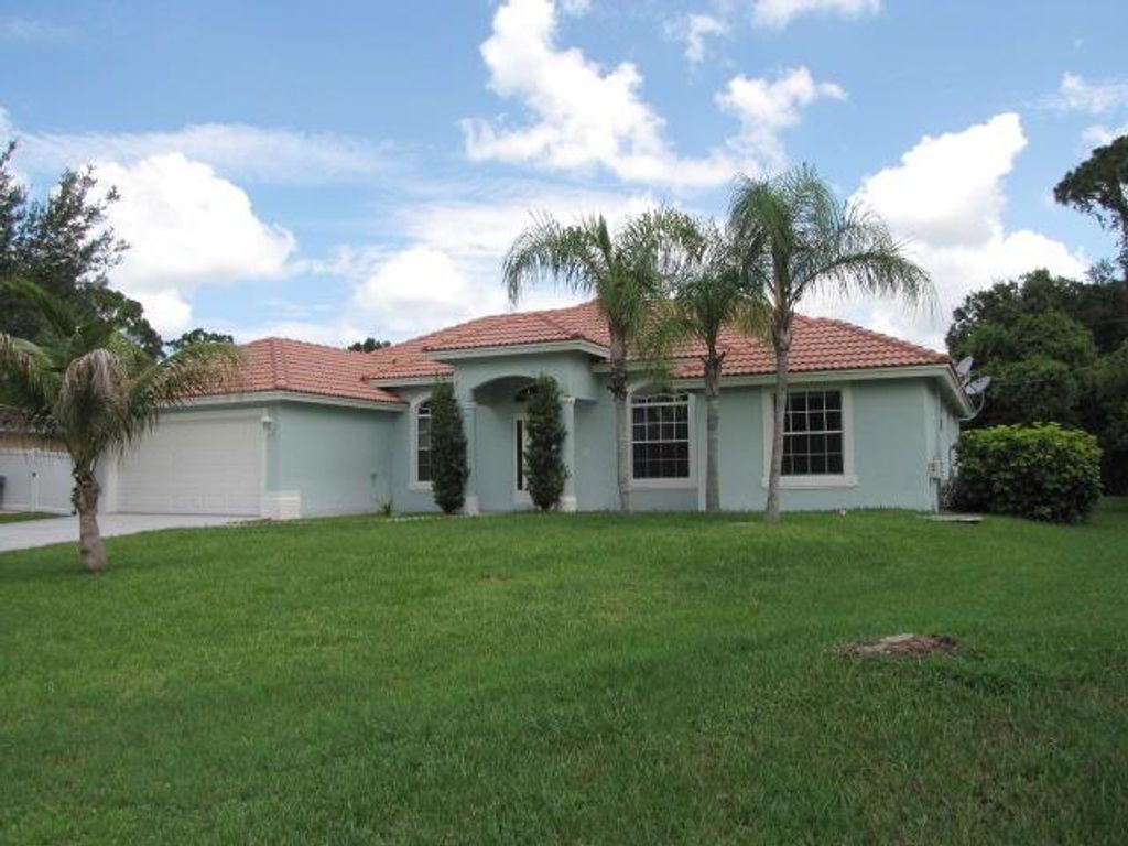 Photo of 1789 SW Desert Avenue, Port Saint Lucie, FL 34953 (MLS # R10946048)