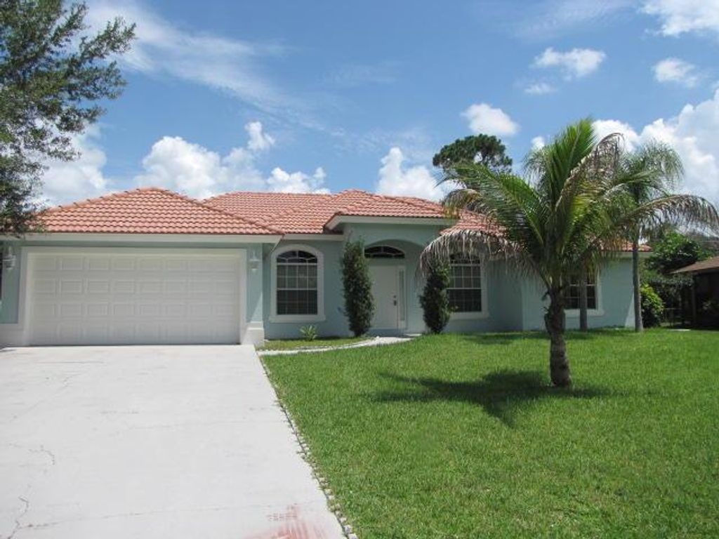 Photo of 1789 SW Desert Avenue, Port Saint Lucie, FL 34953 (MLS # R10946048)