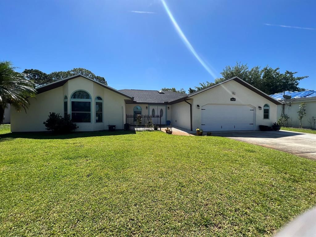 Photo of 1925 SE Cheltenham Street, Port St Lucie, FL 34983 (MLS # R10887748)