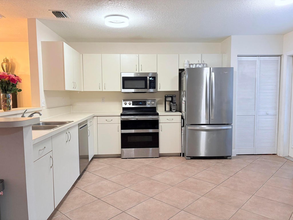 Photo of 72 Fairway Lane, Royal Palm Beach, FL 33411 (MLS # B26039942)