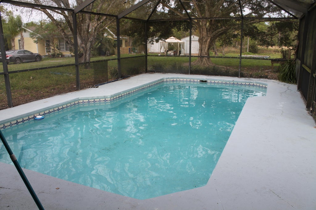 Photo of 7003 SW 39th Street, Palm City, FL 34990 (MLS # B26065393)
