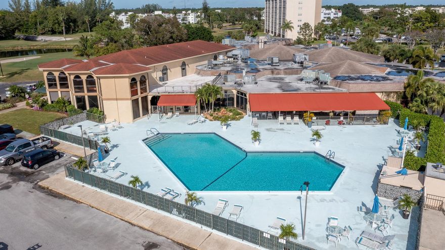 Rare end unit on 5th Floor in Lenox Building overlooking the Golf Course at Poinciana Place, a popular Active Adult Community. Updated 2 Bedroom, 2 Bathroom unit with washer and dryer inside unit.  Elevator Building and close to all the amenities.  18-hole executive golf course, tennis courts, 2 pools, pickle ball, bocce, restaurant and more!  No club fees.  Many activities to participate in if you desire to.  Electrical Panel upgraded in 12/2023.  Move-in Ready unit with lots of extra light. Painted in neutral colors, ready for you to decorate with your special touches. Condo floor plan and walkthrough video available.