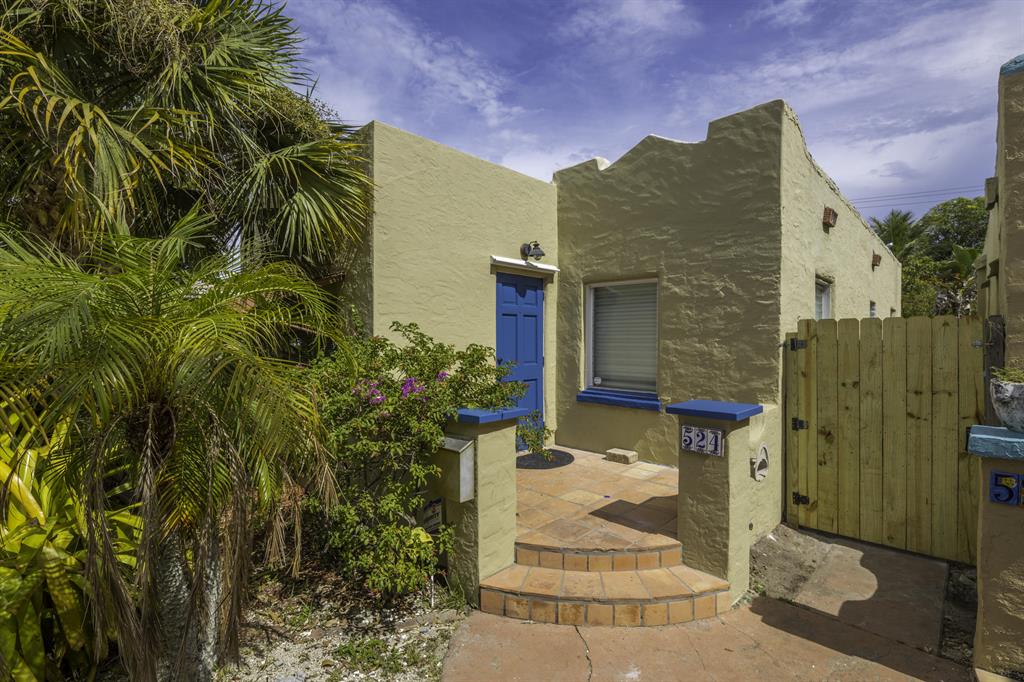 Spanish-style, charming 2-bedroom 1-bathroom home 5 blocks to downtown. Decorative Fireplace and Updated kitchen w/ full size range, New central A/C, hardwood floors. Fenced and landscaped back yard with Covered Patio deck. Large detached workshop/storage garage with washer/dryer. Off-street parking. Walk or bike to downtown and the beach.