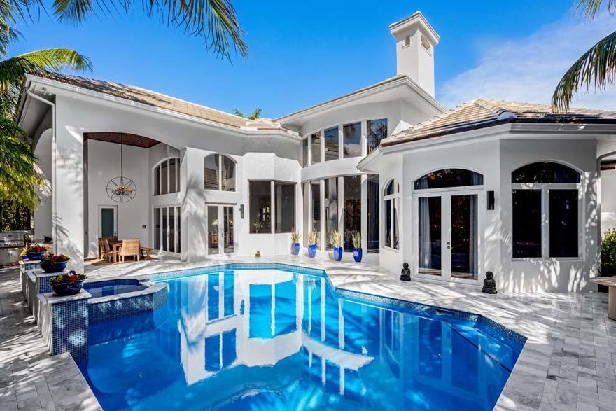 Stunning and private beach area residence awaits at 930 S Ocean Blvd, Delray Beach. Located directly on A1A across from the coveted oceanfront estate section and just blocks from Atlantic Ave, this five bedroom home features a coastal elegance with completely renovated exterior. Situated on an expansive lot with 100 feet of frontage and 151 feet of depth, the property offers unparalleled privacy with courtyard entry, spacious formal and casual living areas, chef's kitchen, first floor master wing, en suite guest bedrooms, three-car garage and manicured grounds. Outdoor entertaining and private retreats are easy with resort style pool with spa, covered loggia, grill with snack bar, poolside open terrace and full cabana bath. Luxury living and seaside serenity await at this beach area oasis.