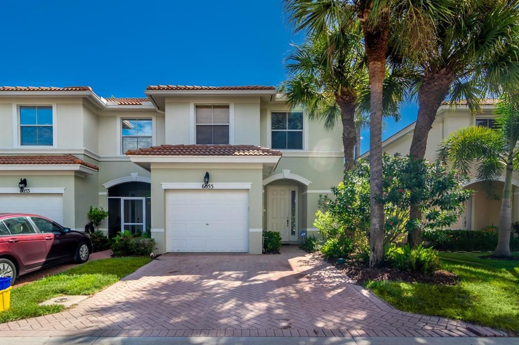 Photo of 6055 Seminole Gardens Circle, Riviera Beach, FL 33418 (MLS # R10750115)