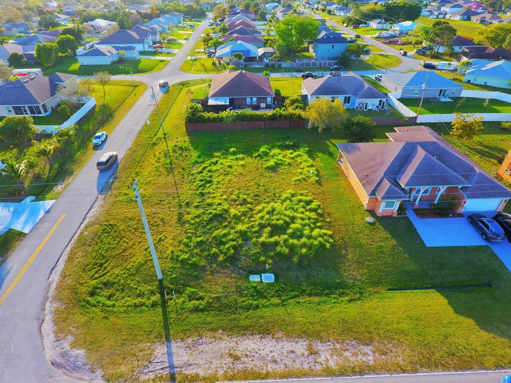 Photo of 1101 SW Haleyberry Avenue, Port Saint Lucie, FL 34953 (MLS # R10965553)