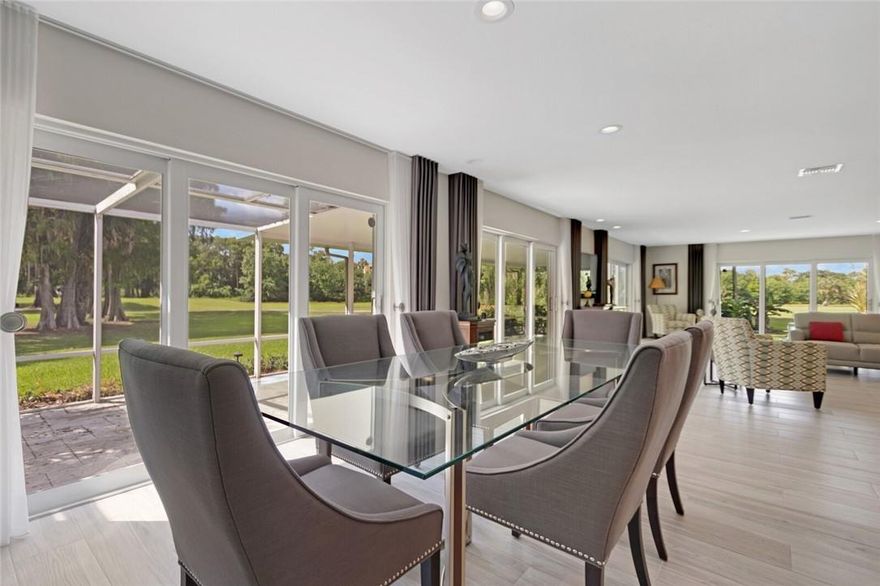 Stunning golf course views from this bright open floor plan 3BR/3BA villa home in highly sought after Palm Aire. 4 sliding glass doors allow for an abundance of light. Inside this private setting home you will see no other homes and only golf course views from the living areas & lanai. Porcelain plank tile throughout the home with travertine on the lanai & patio.  All bedrooms have on-suite bathrooms. Primary Bath 2- person shower all newly tiled in porcelain as well as the guest bath. Impact glass throughout. New water heater, updated electric (including set up for electric car charging) & appliances. Open kitchen with very large quartz countertop. Located across the street from 1 of 2 pools. Villas allow 2 dogs, abundance of walking options within the community. This is a must-see home!