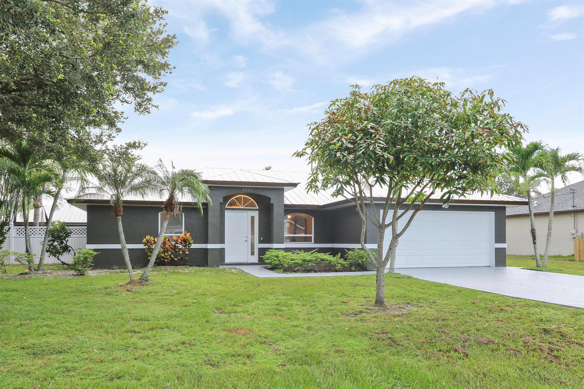 Beautifull 4/2/2 car garage, CBS Home. Huge corner lot property. With a extra separate garage with AC can be easy convert to a mother in law suite good for extra income. 2021 Metal Roof. Heated Pool & Spa. Pool Screen Redone in June 2025