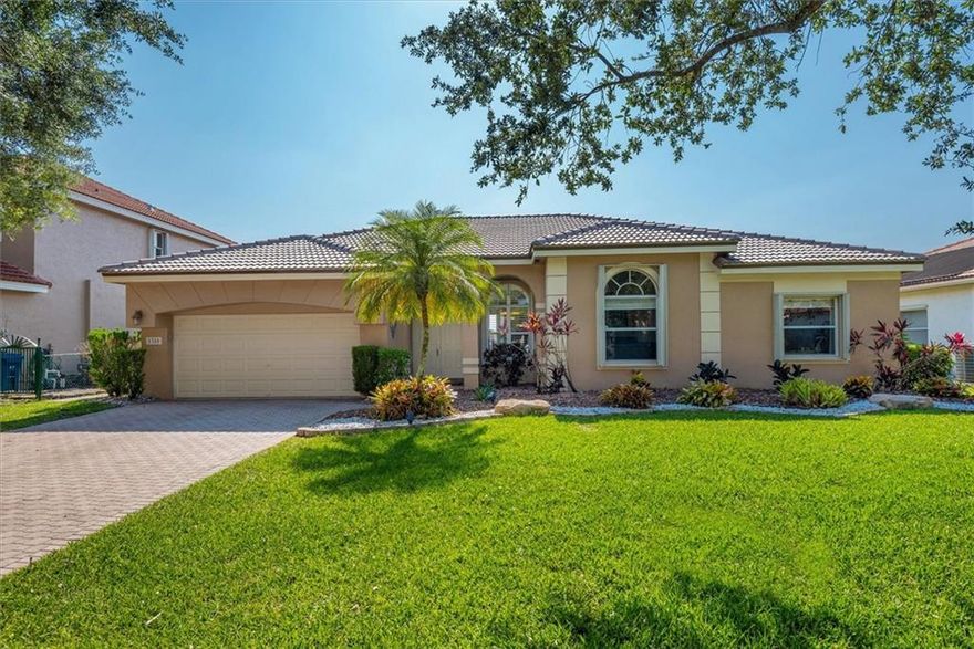 4/2, 2 car garage in the highly sought after community of Yardley Estates. The home features a backyard patio & pool with long water views facing west providing incredible tranquil sunsets. This turn-key home includes a new roof in 2022, new water heater in 2022, Lennox air conditioner just 4 years old, pool has new tile & diamond brite, patio done in Belgium blocks, stone grill island, updated kitchen with granite counters, stainless-steel Kenmore Elite appliances and snack bar/counter, state-of-the-art LG washer & dryer, master bedroom has 2 walk-in California closets, Accordion shutters, google nest security system stays, lawn sprinkler system uses water from canal. Excellent schools, walk to North Community Park. Furniture is negotiable. Ready for you to make this your new dream home!