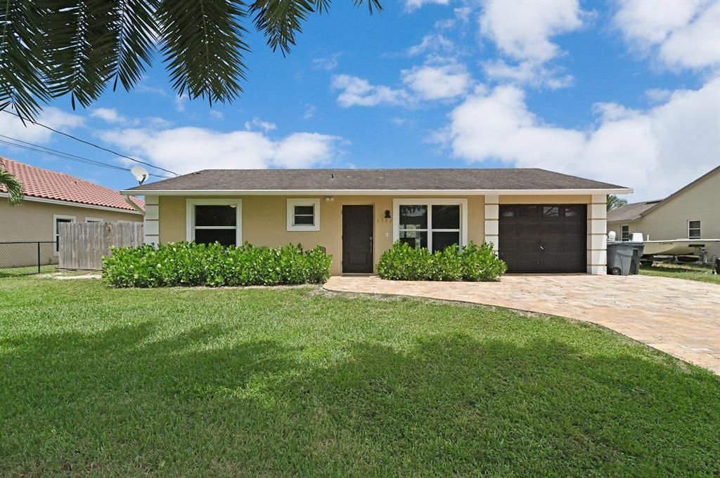 Photo of 6580 Riparian Road Rd, Lake Worth Beach, FL 33462 (MLS # R10823883)