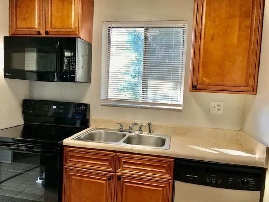 Photo of 6034 Forest Hill Boulevard #104, West Palm Beach, FL 33415 (MLS # R11156418)