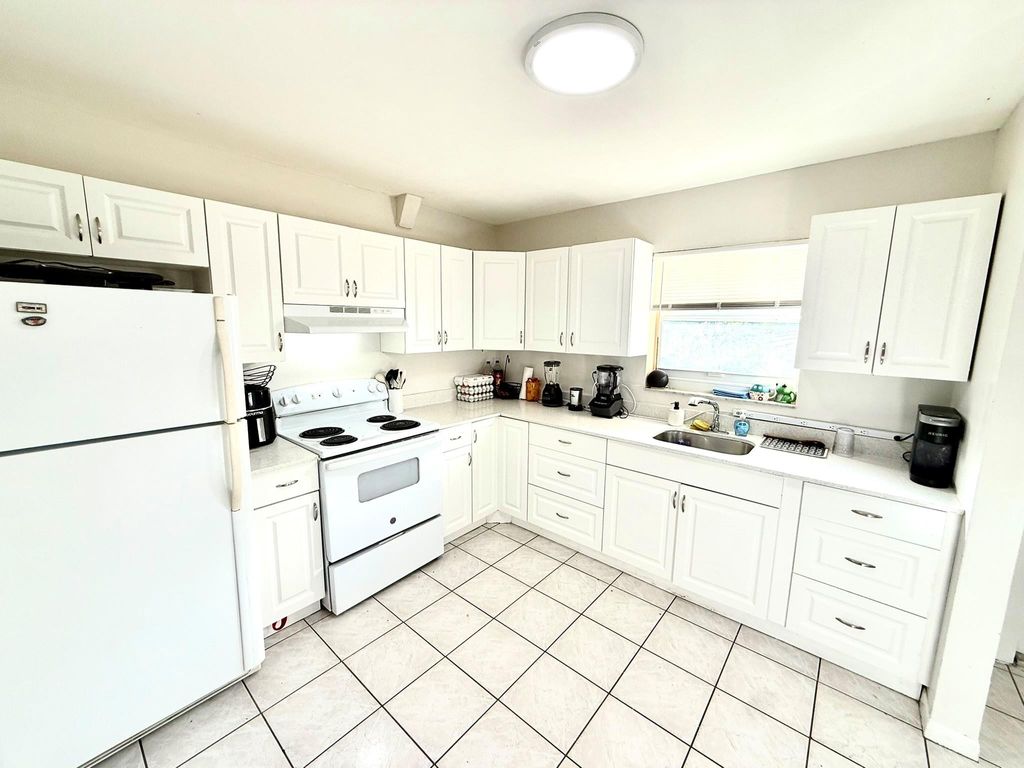 Photo of 3880 Woodside Drive, Coral Springs, FL 33065 (MLS # F10535239)