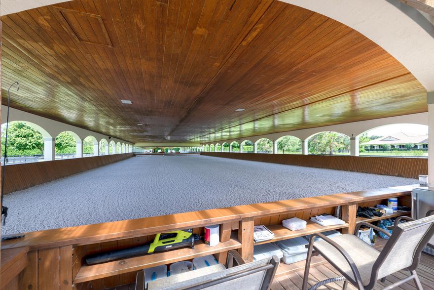 This elite & prestigious sporthorse facility was professionally designed and maintained for top equine athletes. Offering a luxurious equestrian experience, this property boasts 10 acres, an 19 stall show barn, a 3-stall USDA certified quarantine barn, a detached 3 bedroom, 2 bathroom staff house, olympic level 205 x 85 ft covered riding arena with Martin Collins CLOPF footing and a Risohorse sub-irrigation system, a 100 x 220 ft outdoor arena with GGT footing, all-weather GGT round pen, 11 paddocks and 3 RV Hookups. Additionally, there is a newly constructed tent pad with full electricity, water, flyspray system to house 8-10 12x12 portable stalls. Property is ideally set up with 2 large storage containers, extra trailer and equipment parking areas and much more