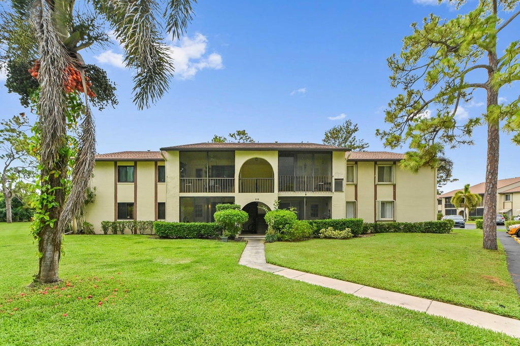 Photo of 319 Knotty Pine Circle #C-1, Greenacres, FL 33463 (MLS # B26037385)