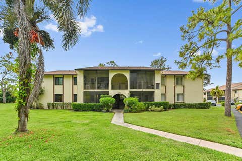 Photo of 319 Knotty Pine Circle #C-1, Greenacres, FL 33463 (MLS # B26037385)