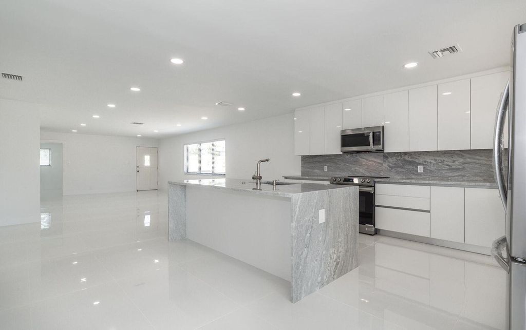 Photo of 524 NW 53rd Street, Boca Raton, FL 33487 (MLS # B26037698)