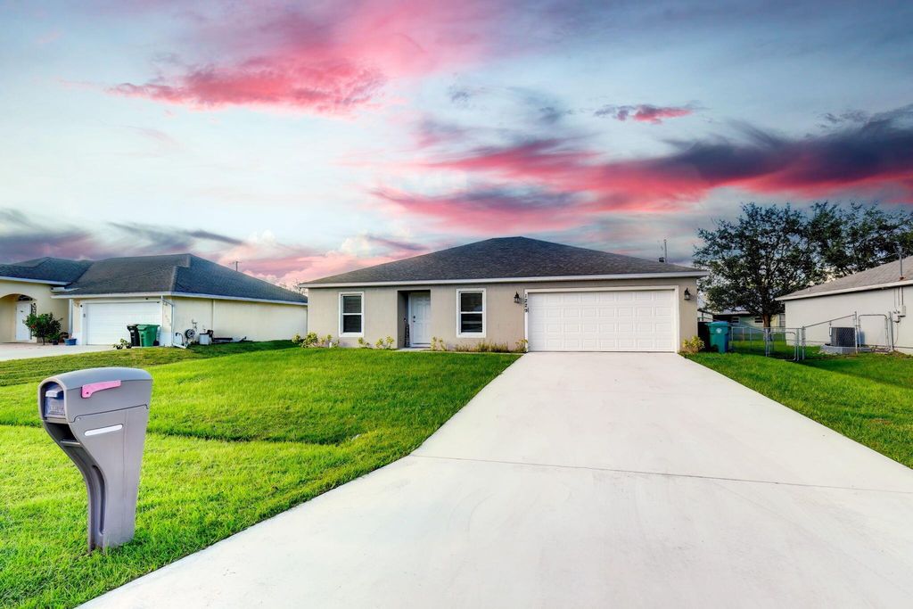 Photo of 1229 SW Asturia Avenue, Port St Lucie, FL 34953 (MLS # R10928877)