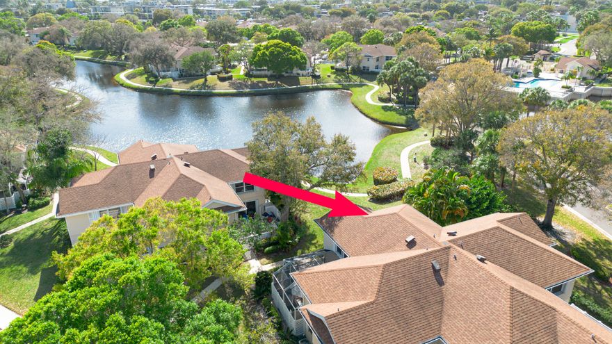 This well-maintained townhome has lake views from both bedrooms and the kitchen.  Both bedrooms have en-suite bathrooms.  There is an additional half bath downstairs.  In unit washer and dryer.  Private courtyard patio with mature palms that provide just the right amount of shade to enjoy the outdoors.  Accordion hurricane shutters.  A/C 1.5 years old.  This beautiful, gated community includes a community pool, tennis courts, playground and walking paths.  HOA dues include upkeep of the park like grounds, manned gate, water, cable, building and roof maintenance and building insurance.  This is not an age restricted community.