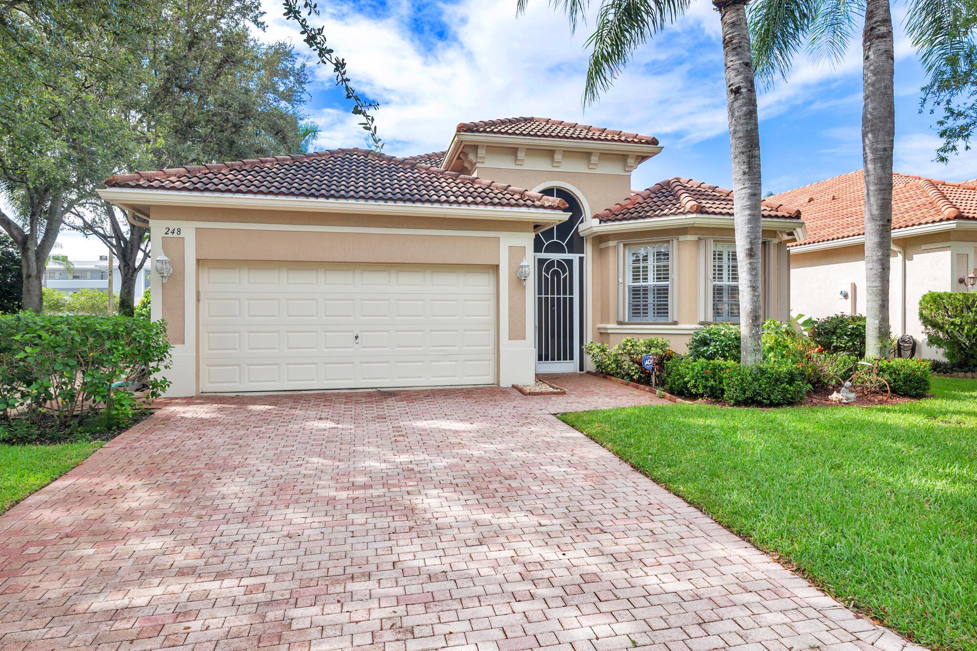 Fantastic opportunity in the City of Atlantis. Rarely available home in The Palms offering 2 bedrooms plus separate office/den, 2 bathrooms, large screened patio, 2 car garage, high ceilings, and much more. Additional features include an open kitchen, spacious master bath with dual sinks, utility room, 2 car driveway, CBS construction, and an abundance of natural light. Very quiet and private location within The Palms community.  City of Atlantis is a private gated community offering two outstanding golf clubs, tennis courts, Kintz Park, and it's own City Council and Police Department. Located adjacent to JFK Hospital, and minutes away from downtown West Palm Beach, Lake Worth, the beach and PBI Airport.